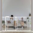 Adjustable baby guard installed in doorway showing telescoping width mechanism