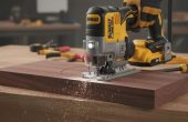 DEWALT 20V MAX XR Jig Saw cutting through hardwood with precision and low vibration.