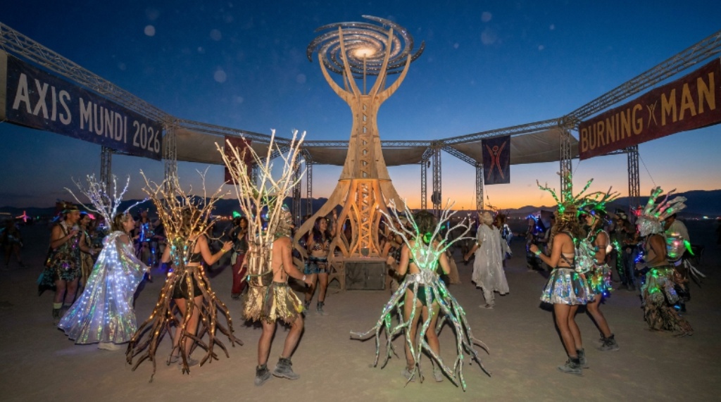 Participants in cosmic tree-inspired costumes celebrating the Axis Mundi theme at Burning Man 2026