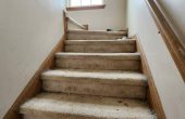 Chicago townhome staircase being cleaned with vacuum attachment