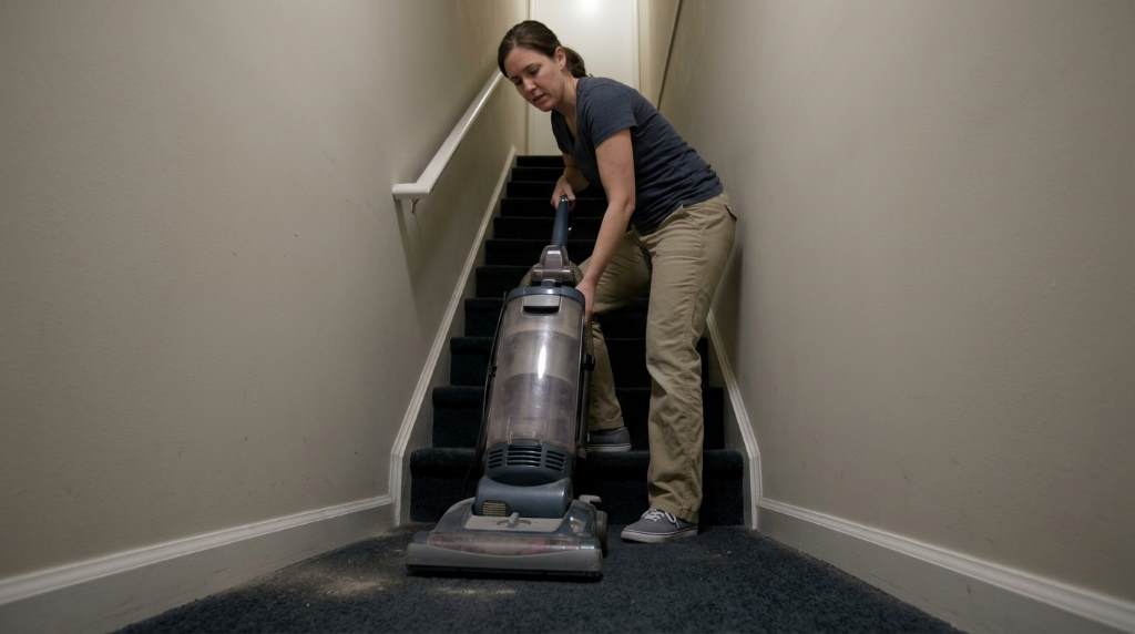 Deep cleaning narrow stairway inside modern Chicago townhome