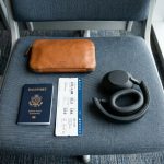 Side by side views of a person wearing wireless headphones while traveling, working, and relaxing.