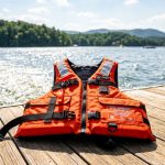 A Coast Guard approved life jacket rests on a boat deck in North Carolina.