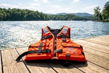 A Coast Guard approved life jacket rests on a boat deck in North Carolina.