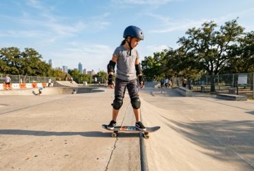 Beginner skateboarder with safety gear preparing to drop into a ramp in Texas.