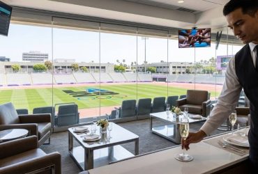 LA28 Olympics hospitality lounge with premium seating overlooking a competition venue