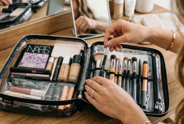Stylish travel makeup bag organizer on a NYC hotel vanity.
