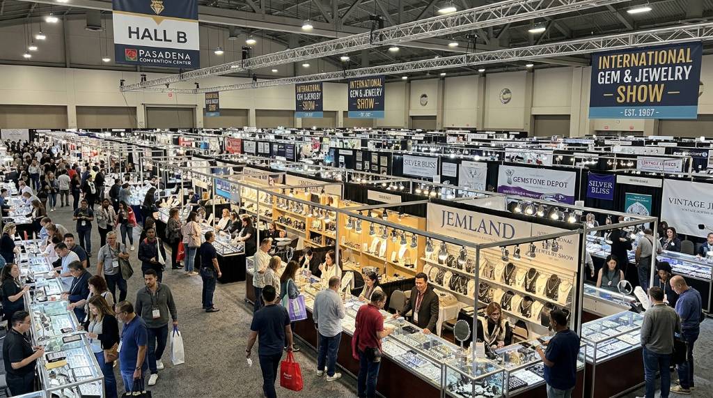 Rows of gemstone and jewelry vendors inside Hall B at the Pasadena Convention Center during the International Gem and Jewelry Show